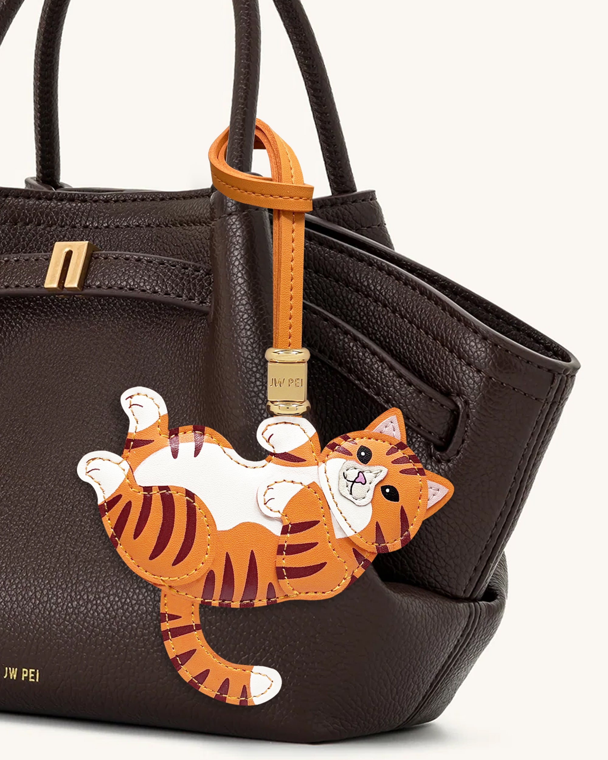 Breloque sac chaton espiègle - Orange